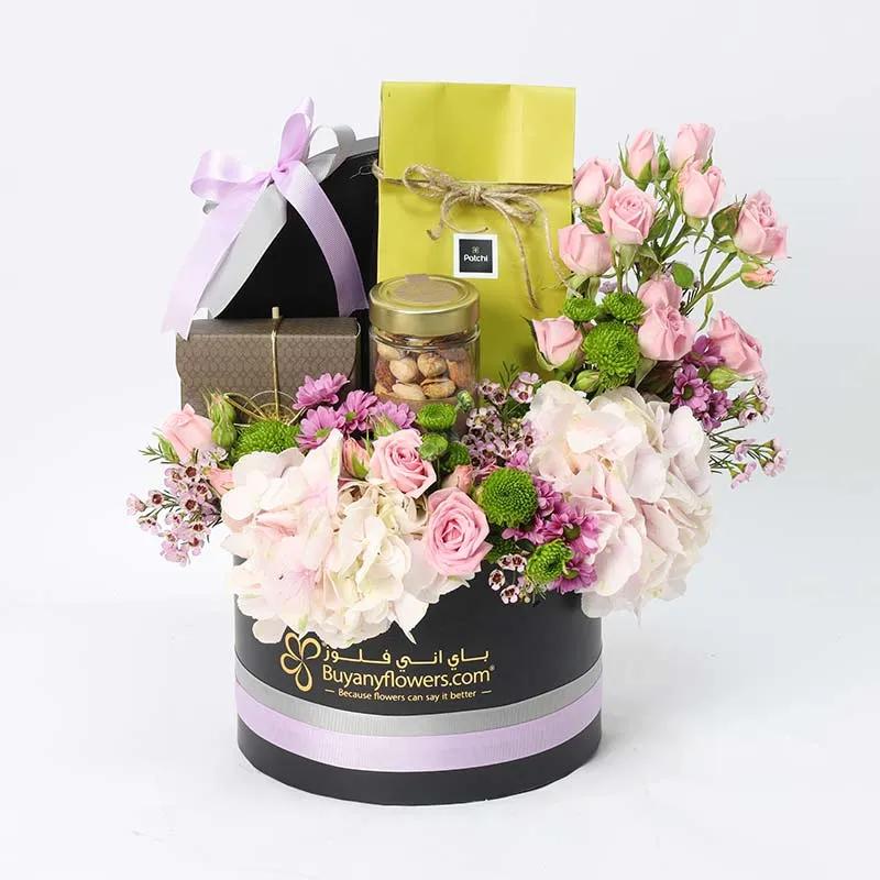 Bateel And Patchi Floral HamperChocolate & ConfectioneryProduct Description Bateel Premium Mixed Arabia Nuts 160gm Premium Bateel Organic Dates 250gms Patchi Deluxe Chocolates 100gm 2 Pink Hydrangea 6 Stems Pink Baby Roses 3 Stems Purple Daisies 2 Stems G