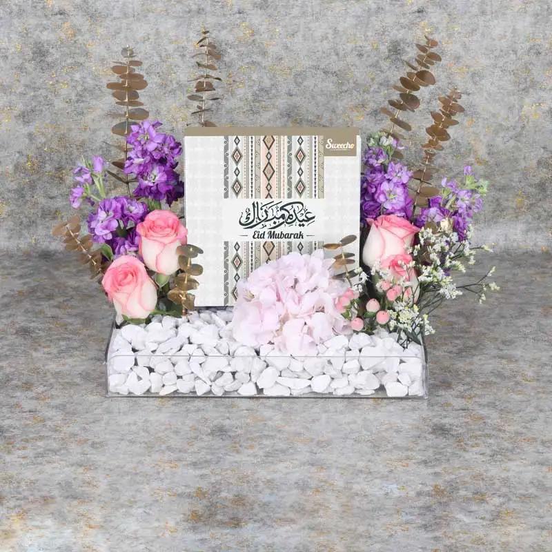 Eid Flower Chocolate Tray PurpleGifts and HampersProduct Description Eid Premium Assorted Stuffed Dates By Sweecho 16 Pcs 4 Dual Dual Pink Roses 4 Stems Purple Matthiola 1 Purple Hydrangea 2 Stems Pink Hypericum Fillers - 1 Stem White Limonium Leaves - 5