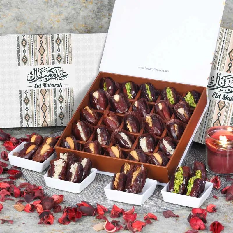 Eid Stuffed Dates By Sweecho 25 Pcs PeachChocolate & ConfectioneryProduct Description Assorted Stuffed Dates Flavors - Pistachio, Orange Peel, Cashew, Walnut and Hazelnut Quantity - 25 Pcs Arranged in a Beautiful Eid Gift Box