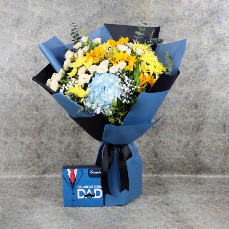 Alpha Flower Bouquet and Assorted ChocolatesChocolate & ConfectioneryPremium Assorted Chocolates 16 Pcs By Sweecho, 1 Blue Hydrangea, 4 Sunflowers, 7 Stems Peach Baby Roses, 5 Stems Yellow Chrysanthemums, 6 Stems Solidago, Leaves : 1 Song of India and 6 E