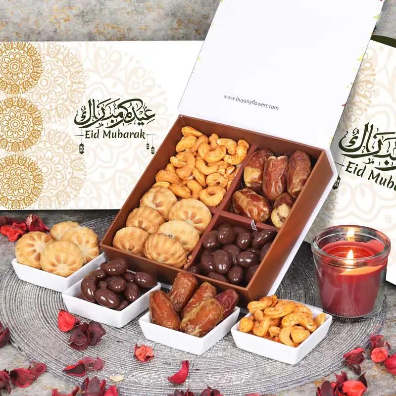 Delightful Eid Gift Box GreenChocolate & ConfectioneryProduct Description Plain Dates 80gm Approx Chocolate Coated Almonds 100gm Approx Mamoul Dates 100gm Approx Chilli Cashews 100gm Approx Arranged in a Gift Box