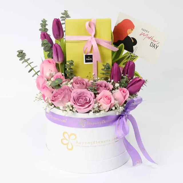 Patchi Floral Blessings for Mothers DayChocolate & Confectionery6 Purple Tulips 6 Pink Roses 4 Purple Roses Leaves - 1 Song of India, 2 Stems Eucalyptus and 1 Gypso 100gm Deluxe Patchi Chocolates Mothers Day Tag Prepared in a White Round Box Tied with a R