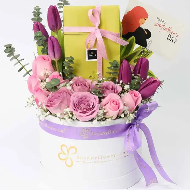 Patchi Floral Blessings for Mothers DayChocolate & Confectionery6 Purple Tulips 6 Pink Roses 4 Purple Roses Leaves - 1 Song of India, 2 Stems Eucalyptus and 1 Gypso 100gm Deluxe Patchi Chocolates Mothers Day Tag Prepared in a White Round Box Tied with a R