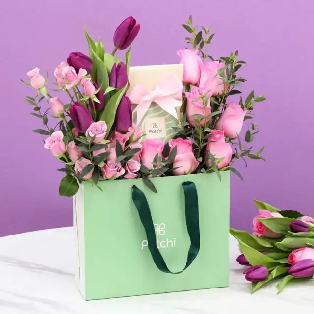 Purple and Pink Patchi Floral ArrangementGifts and HampersDeluxe Patchi Chocolates 100gm 6 Purple Tulips 7 Pink Roses 4 Stems Purple Baby Roses Leaves - 1 Stem Palviforia Prepared in Patchi Bag