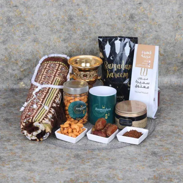 Ramadan Kareem HamperGifts and HampersHamper Includes: 1 Prayer Mat Assorted Color 1 Prayer Beads Assorted Color 1 Swiss Arabia Bakhoor 1 Bakhoor Burner Madjool Dates in Assorted Ramadan Kareem Pouch 100gm Arabic Coffee 100gm 1 Ramadan Kareem Coffee Mug C