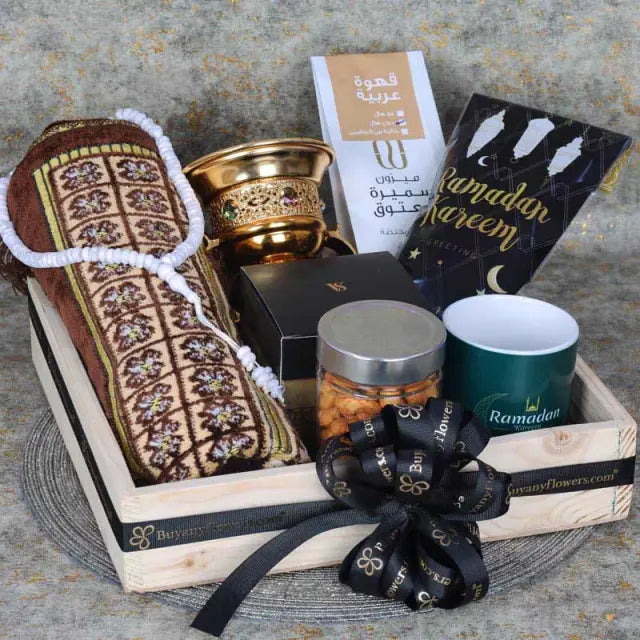 Ramadan Kareem HamperGifts and HampersHamper Includes: 1 Prayer Mat Assorted Color 1 Prayer Beads Assorted Color 1 Swiss Arabia Bakhoor 1 Bakhoor Burner Madjool Dates in Assorted Ramadan Kareem Pouch 100gm Arabic Coffee 100gm 1 Ramadan Kareem Coffee Mug C