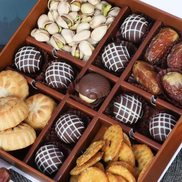 Ramadan Delight Gift Box GreenGifts and HampersGifts Includes: Premium Truffle Chocolates 9 Pcs Pistachio 100gm Approx Plain Dates 80gm Approx Mamoul Dates 100gm Approx Baked Pretzos 60gm Approx Arranged in a Gift Box