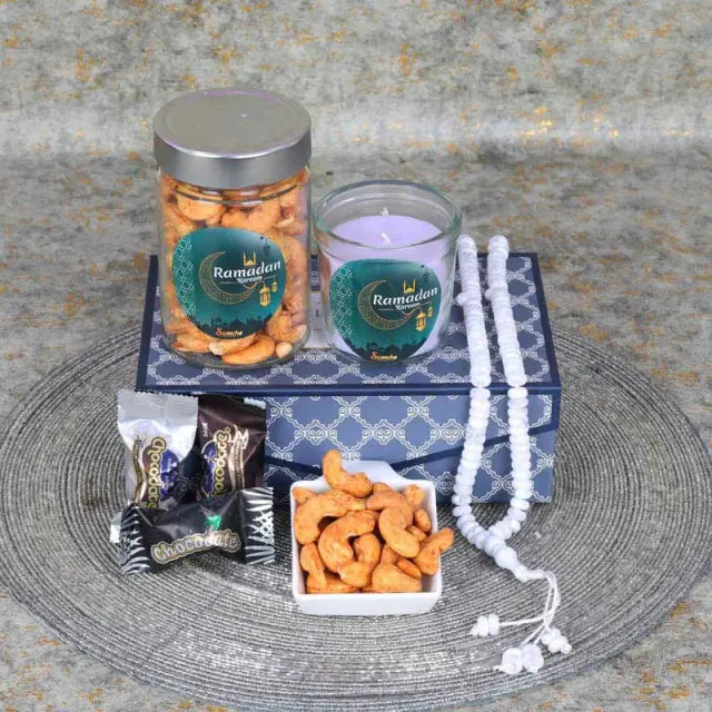 Ramadan Meditating Aroma HamperGifts and HampersHamper Includes: 1 Prayer Beads Chocolate Coated Dates with Nuts 5 Pcs Chilli Cashews in a Jar 150gm 1 Scented Jar Candle Arranged in a Gift Box