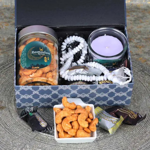 Ramadan Meditating Aroma HamperGifts and HampersHamper Includes: 1 Prayer Beads Chocolate Coated Dates with Nuts 5 Pcs Chilli Cashews in a Jar 150gm 1 Scented Jar Candle Arranged in a Gift Box