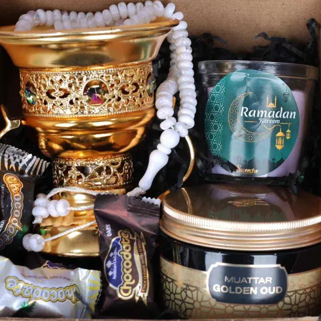 Ramadan Meditating Fragrance HamperGifts and HampersHamper Includes: 1 Prayer Beads 1 Swiss Arabia Bakhoor 1 Bakhoor Burner 1 Scented Jar Candle Chocolate Coated Dates with Nuts 5 Pcs Arranged in a Box