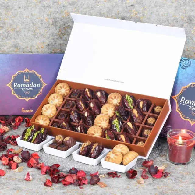 Ramadan Stuffed Dates Mamoul and Chocolates By Sweecho 32 Pcs BlueGifts and HampersAssorted Stuffed Dates, Mamoul and Chocolates Flavors - Pistachio, Cashew and Walnut, Coffee and Biscoff Quantity - 32 Pcs Arranged in a Beautiful Ramadan Gift Box