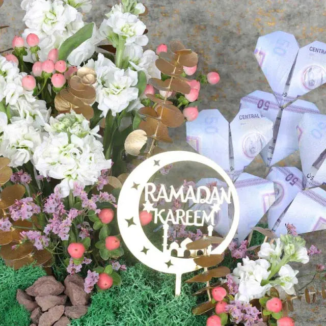 Ramadan Dirham Flower WishesGifts and Hampers6 Notes of AED 50 6 Stems White Matthiola 5 Pink Hypericum Leaves - 4 Stems Golden Sprayed Eucalyptus Fillers - 2 Stems Pink Limonium Decorated with Green Moss Ramadan Kareem Topper Prepared in Small Acrylic Tr