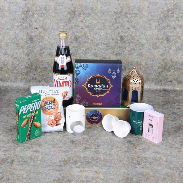 Ramadan Together Gift HamperGifts and HampersHamper Includes: Assorted Stuffed Dates Box 16 Pcs By Sweecho 1 Aroma Oil 1 Oil Burner with Tlight Candle 1 Vimto Fruit Cordial 710ml Lotte Pepero Almond and Chocolate Sticks 32gm Hunters Gourmet Baked Pretzos