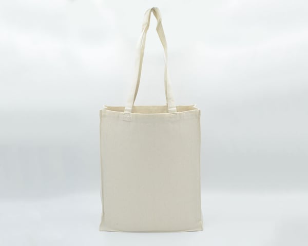 Eco Greeni Cotton Bag 225gsm 33x40x12 - 100 PcsSustainable LivingThese bags are strong and durable making them ideal for various purposes. It provides a good balance between sturdiness and flexibility. The cotton material offers breathability which is adv