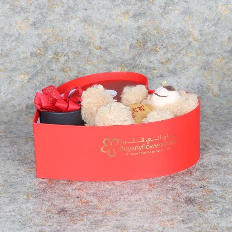 Womens Day Gift Box RedGifts and HampersGift Includes: 1 Red Forever Rose in Black Box Premium Rose Flavor Milk Cake 500gm You Are Amazing Teddy Bear 20gm 1 Jar Candle 1 Bath Bomb Arranged in a Heart Shape Box