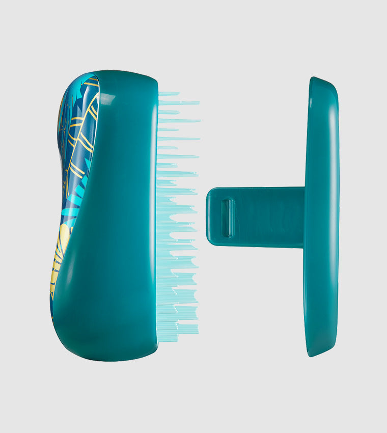 Compact Styler - Midnight TropicsHair CareA stunning petrol and gold leaf palm print adds the wow factor to this Christmas collection Compact Styler. A bag friendly hairbrush that detangles and styles. It delivers the perfect finishing touch when travelli