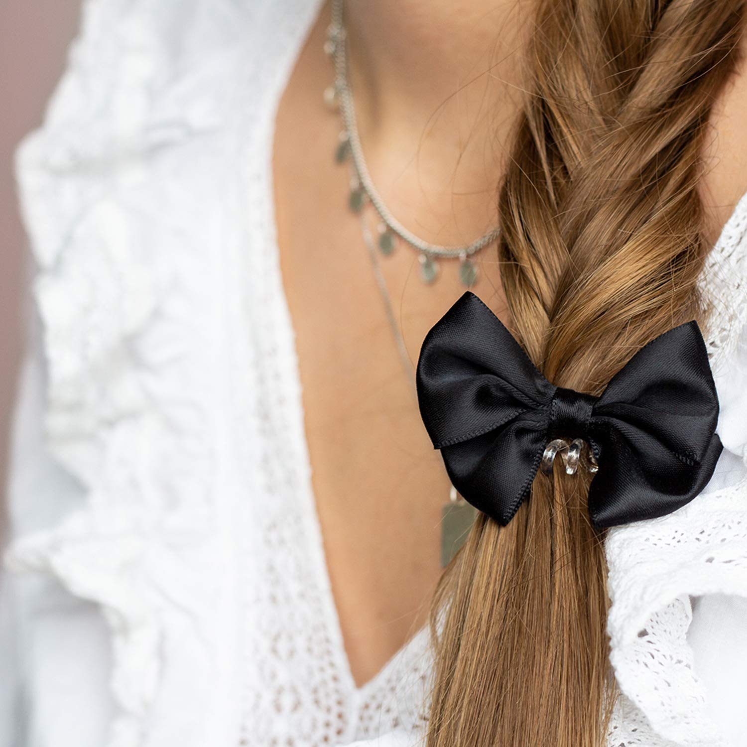 Bowtique True BlackHair CareHair type: normal invisibobble slim with elegant bow Creates a bouncy ponytail or a voluminous bun Ultimate trend accessory Gentle on hair.Comfortable to wear