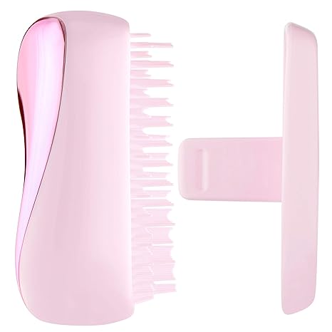Compact Styler - Baby Pink ChromeHair CareCompact Styler Baby Pink Chrome Sweet and chic with super-light hues of blush, rose and peony that catch and reflect the light, our bag friendly hairbrush detangles and styles. Our bag friendly hairbrush detangles