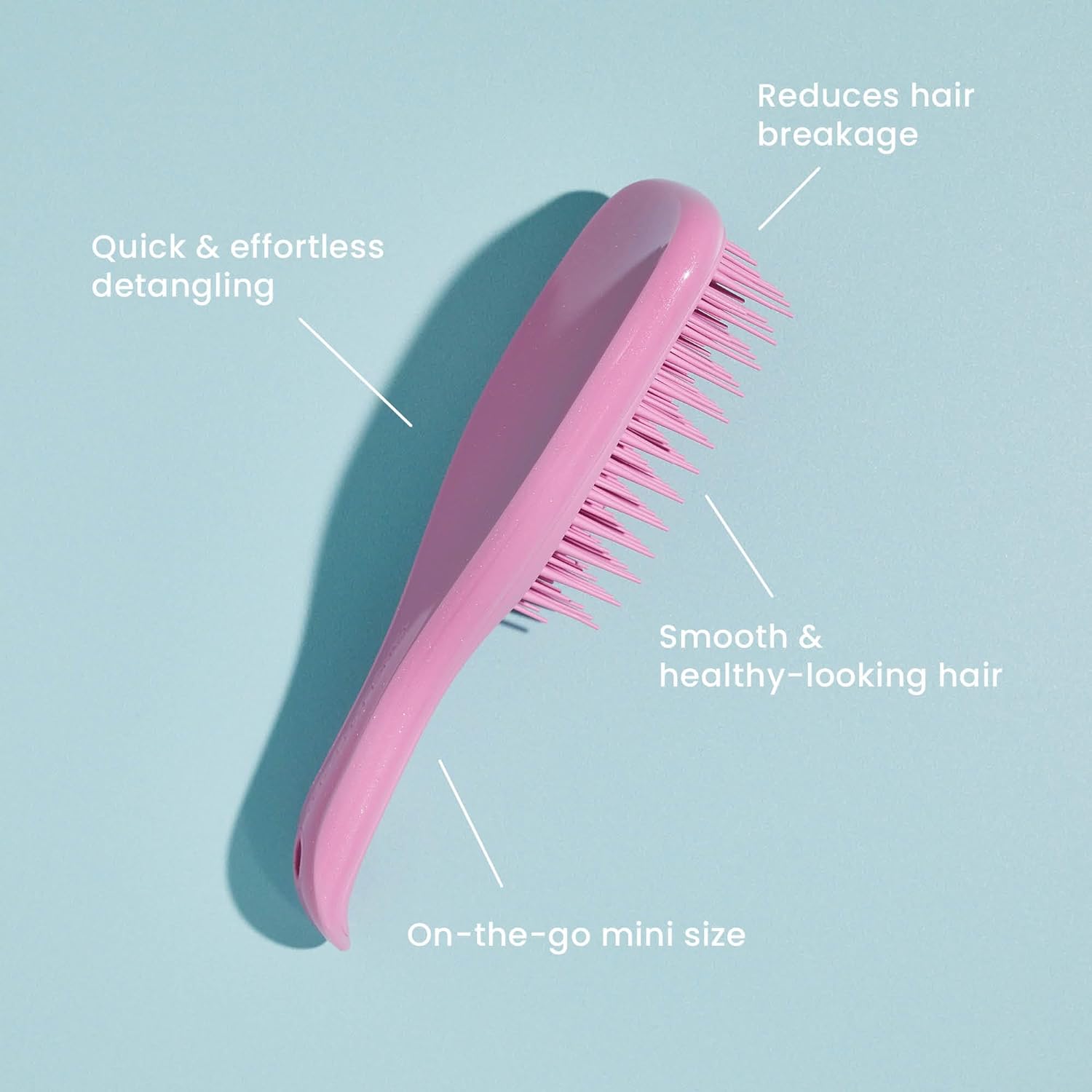 Mini Wet Detangler - Mint /MintHair CareOur Mini Wet Detangler has had a sweet treat makeover! Using the same patented two-tiered teeth technology as The Wet Detangler, this size is perfect for travel, and has a savvy keyring hole on the handle that allow