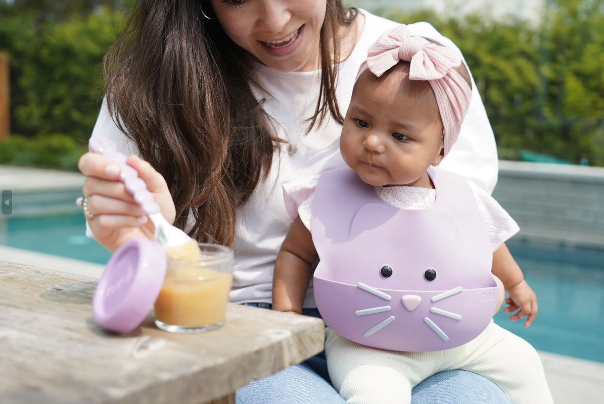 Melii Silicone Bib - Purple CatNursing & FeedingWith our Silicone Cat Bib your little one can eat (and stay clean!) in adorable style! Our playful, cute cat bib is waterproof and makes feeding and mealtime fun! Made of soft high-quality 100% food grade si