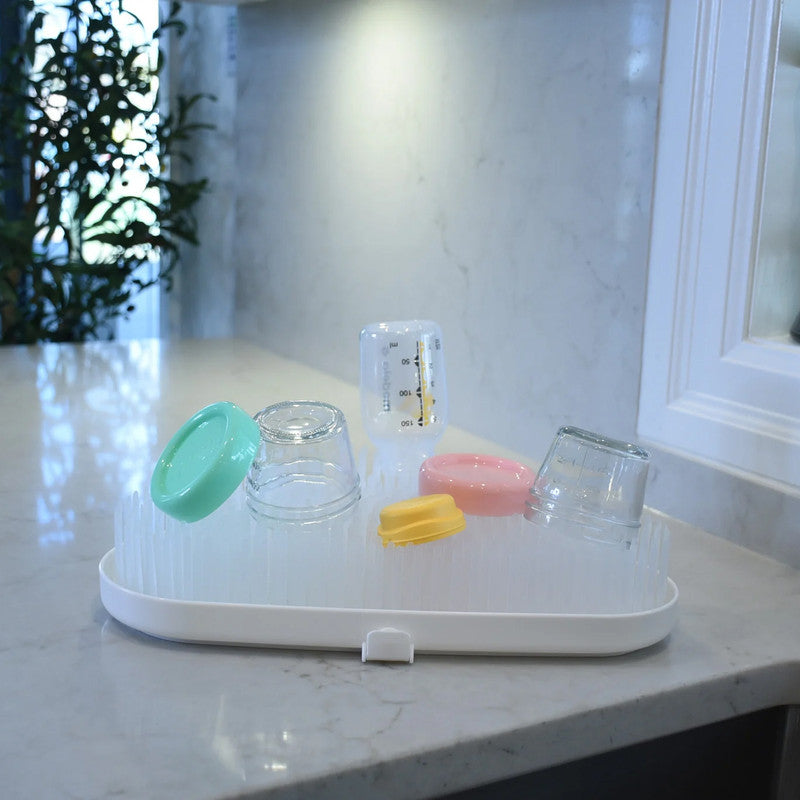 Melii Drying Rack - White CloudNursing & FeedingFrom baby bottles, nipples, pacifiers, and breast pump parts, to cutlery and sippy cups, our drying rack is perfect for drying all your baby, toddler and kid’s feeding necessities. Make cleaning up after fee