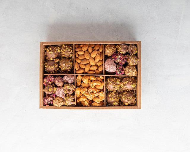Diwali Assortment by NJDChocolate & ConfectioneryYOUR GIFT CONTAINS Content: Assorted Truffles 12pcs Assorted Dates 18pcs Almonds 150gms Caramelized Cashews 150gms Flavours: Dates Rose, coconut, wafer, caramelized pistachio, roasted vermicelli Truffles Ro