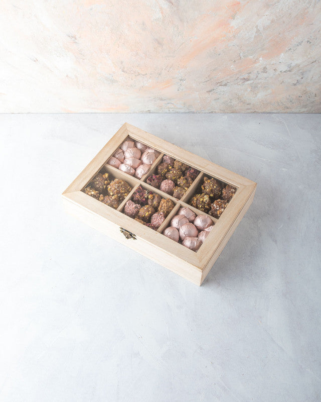 Timeless Diwali Gift by NJDNuts, Dates & Dried FruitsYOUR GIFT CONTAINS Content: Assorted Chocolates 25pcs Assorted Truffles 12pcs Assorted Dates 20pcs Flavors: Assorted Chocolates with Praline, Ganache, Roasted Nuts, Caramel Assorted truffles with Pralin