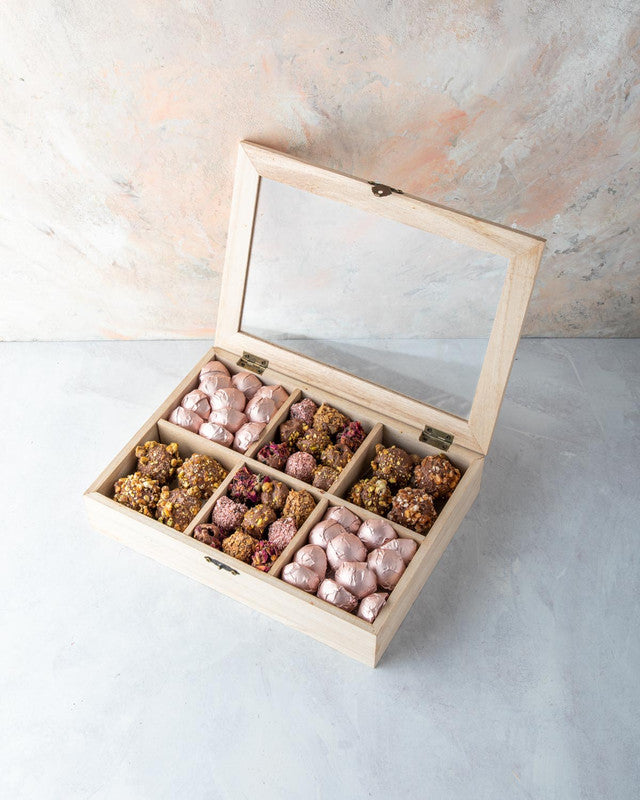 Timeless Diwali Gift by NJDNuts, Dates & Dried FruitsYOUR GIFT CONTAINS Content: Assorted Chocolates 25pcs Assorted Truffles 12pcs Assorted Dates 20pcs Flavors: Assorted Chocolates with Praline, Ganache, Roasted Nuts, Caramel Assorted truffles with Pralin