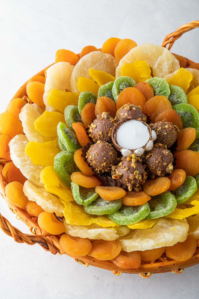 Dried Fruits Hamper by NJDNuts, Dates & Dried FruitsYOUR GIFT CONTAINS Content: Dried Pineapple 700gms Dried Kiwis 180gms Dried Apricot 500gms Assorted Truffles 8pcs Dried Mango 150gms Diya (1pc) Flavor: Assorted truffles with Praline, Ganache, Caramel fi