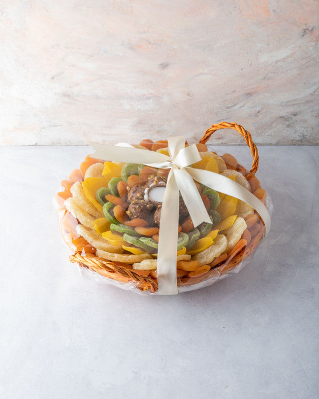 Dried Fruits Hamper by NJDNuts, Dates & Dried FruitsYOUR GIFT CONTAINS Content: Dried Pineapple 700gms Dried Kiwis 180gms Dried Apricot 500gms Assorted Truffles 8pcs Dried Mango 150gms Diya (1pc) Flavor: Assorted truffles with Praline, Ganache, Caramel fi