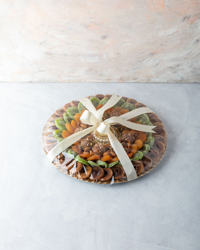 Diwali Dried Fruits Hamper by NJDChocolate & ConfectioneryYOUR GIFT CONTAINS Content (approx. weight): Dried Figs 300gms Dried Kiwis 250gms Dried Apricot 200gms Almonds 100gms Assorted Truffles 8pcs Diya (1pc) (design may vary) Flavors: Assorted truffles