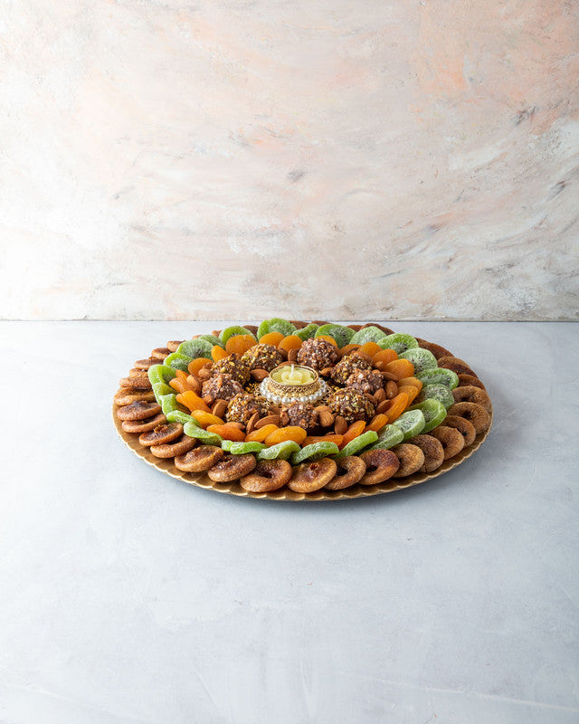 Diwali Dried Fruits Hamper by NJDChocolate & ConfectioneryYOUR GIFT CONTAINS Content (approx. weight): Dried Figs 300gms Dried Kiwis 250gms Dried Apricot 200gms Almonds 100gms Assorted Truffles 8pcs Diya (1pc) (design may vary) Flavors: Assorted truffles