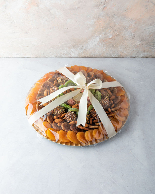 Assorted Dried Fruits Arrangement by NJDNuts, Dates & Dried FruitsYOUR GIFT CONTAINS Content: Dried Figs 250 gms Dried Kiwis 150 gms Dried Apricot 350 gms Almonds 100 gms Truffles 12 pcs Diya 1 pcs (design may vary) Flavors: Truffles - with caramelized Pi
