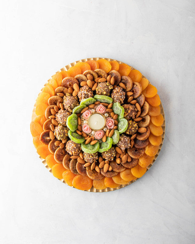 Assorted Dried Fruits Arrangement by NJDNuts, Dates & Dried FruitsYOUR GIFT CONTAINS Content: Dried Figs 250 gms Dried Kiwis 150 gms Dried Apricot 350 gms Almonds 100 gms Truffles 12 pcs Diya 1 pcs (design may vary) Flavors: Truffles - with caramelized Pi