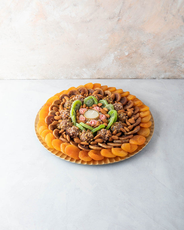 Assorted Dried Fruits Arrangement by NJDNuts, Dates & Dried FruitsYOUR GIFT CONTAINS Content: Dried Figs 250 gms Dried Kiwis 150 gms Dried Apricot 350 gms Almonds 100 gms Truffles 12 pcs Diya 1 pcs (design may vary) Flavors: Truffles - with caramelized Pi