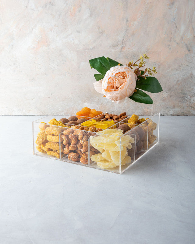 Diwali Gift Box by NJDNuts, Dates & Dried FruitsYOUR GIFT CONTAINS Content (approx.): Apricot 80gms Almonds 80gms Savory 150gms Indian savory snack with sesame seeds Truffles 16pcs assorted Dried Mango 80gms Caramelized Cashews 90gms Dried Pineapple 90gms