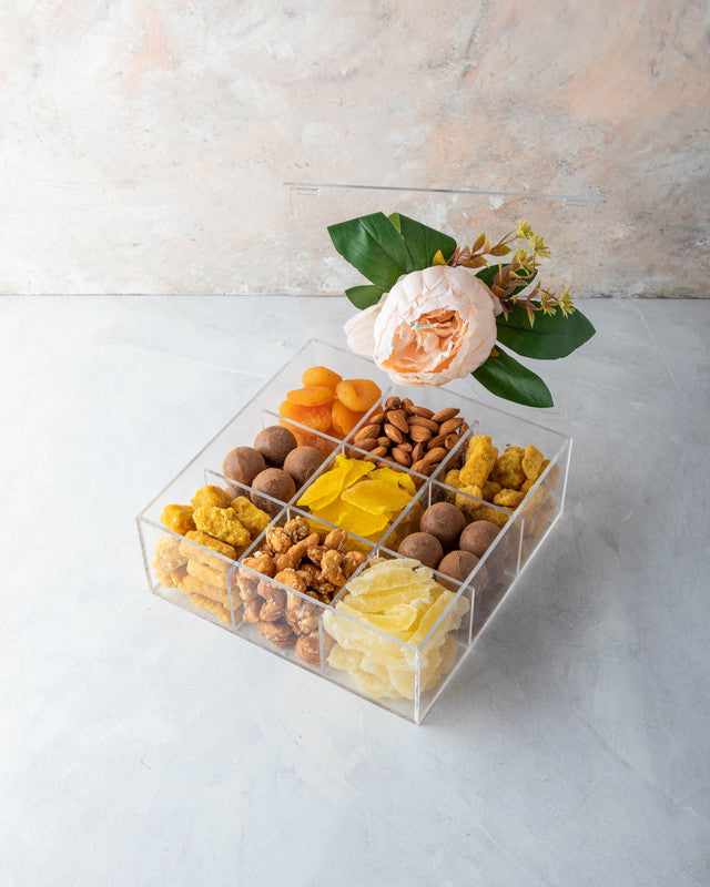 Diwali Gift Box by NJDNuts, Dates & Dried FruitsYOUR GIFT CONTAINS Content (approx.): Apricot 80gms Almonds 80gms Savory 150gms Indian savory snack with sesame seeds Truffles 16pcs assorted Dried Mango 80gms Caramelized Cashews 90gms Dried Pineapple 90gms