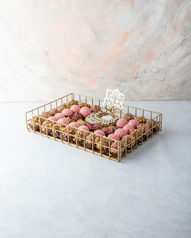 Luxury Diwali Gift by NJDNuts, Dates & Dried FruitsYOUR GIFT CONTAINS Content: 6pcs Chocolate Dates 18pcs Roasted Nuts Truffles 14pcs Rose truffles 1 Designer Diya - (design may vary) Flavors: Dates: rose, caramelized nuts Assorted truffles coated with ca