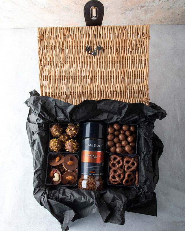Diwali Gift Hamper by NJDChocolate & ConfectioneryYOUR GIFT CONTAINS Content: Davidoff Coffee - 100gms Truffles - 8 pcs Assorted Biscoff balls - 150gms Chocolate covered Pretzels - 100gms Chocolate discs 150gms Flavors: Assorted truffles with roasted nuts