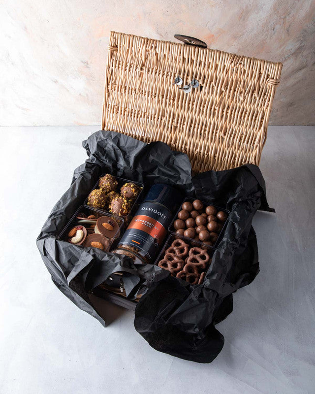 Diwali Gift Hamper by NJDChocolate & ConfectioneryYOUR GIFT CONTAINS Content: Davidoff Coffee - 100gms Truffles - 8 pcs Assorted Biscoff balls - 150gms Chocolate covered Pretzels - 100gms Chocolate discs 150gms Flavors: Assorted truffles with roasted nuts