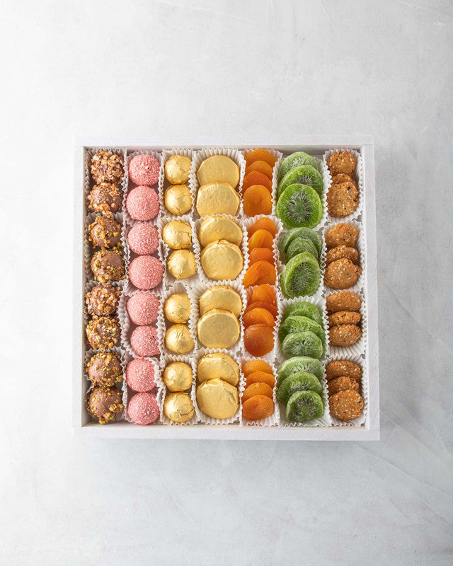 Seven of a kind by NJDNuts, Dates & Dried FruitsYOUR GIFT CONTAINS Content: Truffles 24pcs Chocolate covered Oreo coins 12pcs Dried Apricot 160gms Dried Kiwis 130gms Savory cookies 150gms Flavors: Truffles: Roasted Nuts, Rose & Coconut and Pralines Tray d