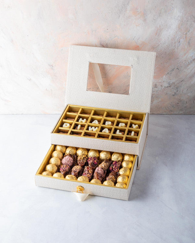 Diwali Gift by NJDChocolate & ConfectioneryYOUR GIFT CONTAINS Content: Assorted Chocolates 24pcs Assorted Dates 12pcs Assorted Belgian Chocolate Truffles 20pcs Flavors Belgian milk chocolates with Nutella, Hazelnut, Pralines, Ganache, Caramel and Biscoff