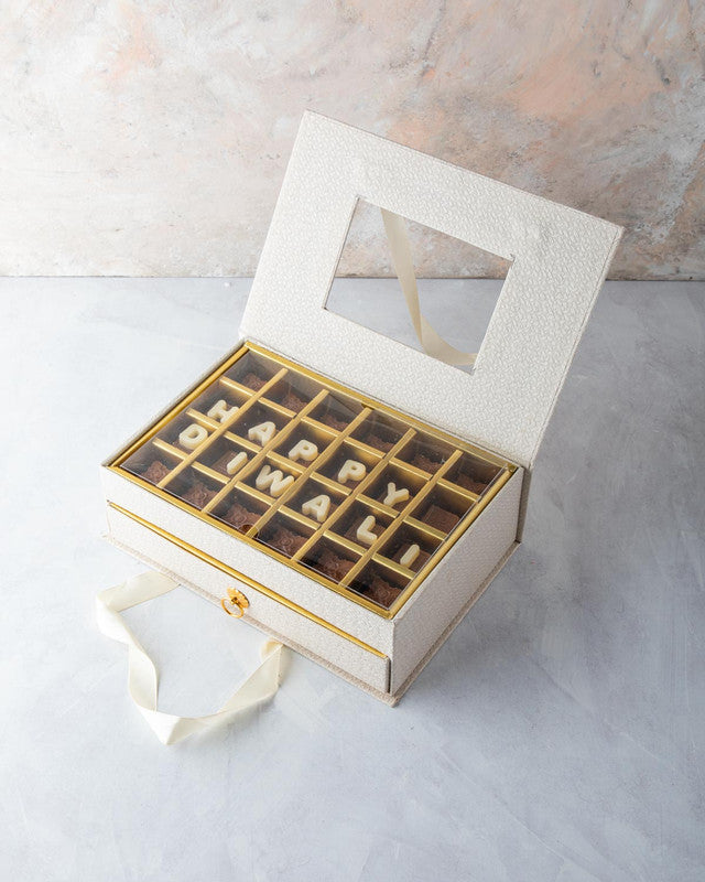 Diwali Gift by NJDChocolate & ConfectioneryYOUR GIFT CONTAINS Content: Assorted Chocolates 24pcs Assorted Dates 12pcs Assorted Belgian Chocolate Truffles 20pcs Flavors Belgian milk chocolates with Nutella, Hazelnut, Pralines, Ganache, Caramel and Biscoff