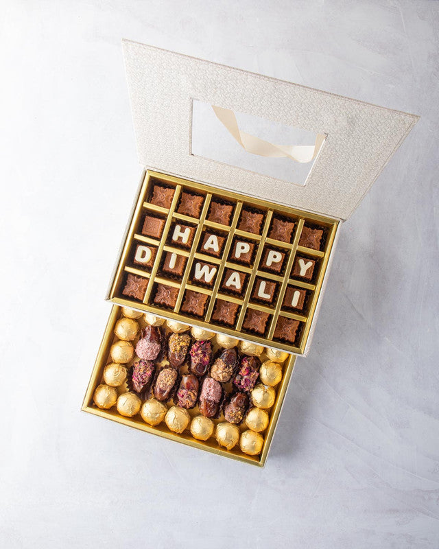 Diwali Gift by NJDChocolate & ConfectioneryYOUR GIFT CONTAINS Content: Assorted Chocolates 24pcs Assorted Dates 12pcs Assorted Belgian Chocolate Truffles 20pcs Flavors Belgian milk chocolates with Nutella, Hazelnut, Pralines, Ganache, Caramel and Biscoff