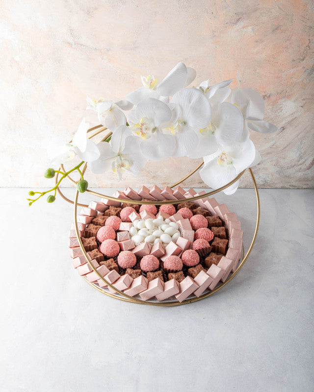 Diwali Hamper by NJDChocolate & ConfectioneryYOUR GIFT CONTAINS Content: Assorted Belgian Milk Chocolates 68pcs Assorted truffles 14pcs White Drageè 150gms Flavors Assorted Rose truffles with hint of coconut. Drageè - Almond, sugar coated Assorted Belgian