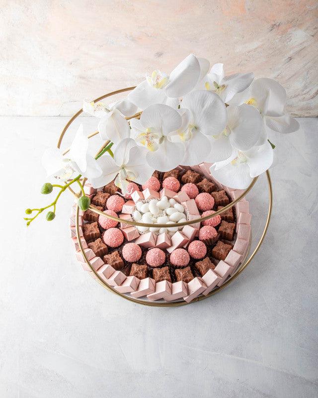 Diwali Hamper by NJDChocolate & ConfectioneryYOUR GIFT CONTAINS Content: Assorted Belgian Milk Chocolates 68pcs Assorted truffles 14pcs White Drageè 150gms Flavors Assorted Rose truffles with hint of coconut. Drageè - Almond, sugar coated Assorted Belgian