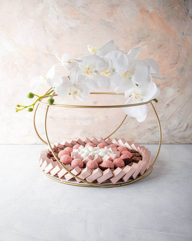 Diwali Hamper by NJDChocolate & ConfectioneryYOUR GIFT CONTAINS Content: Assorted Belgian Milk Chocolates 68pcs Assorted truffles 14pcs White Drageè 150gms Flavors Assorted Rose truffles with hint of coconut. Drageè - Almond, sugar coated Assorted Belgian