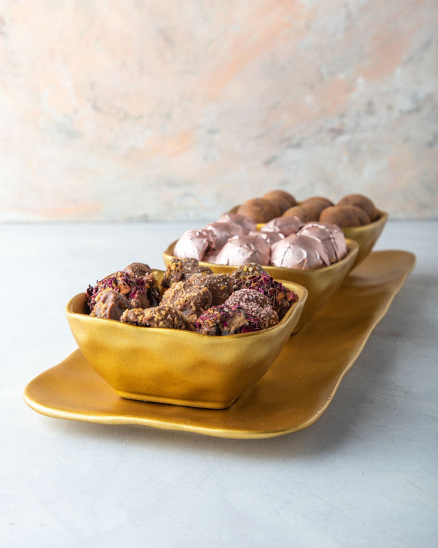 Luxe Collection by NJDChocolate & ConfectioneryYOUR GIFT CONTAINS Content: Assorted Belgian Milk chocolate 18pcs Chocolates covered assorted Dates 11pcs Assorted Truffles 13pcs Flavors Assorted chocolates (Milk) - Nutella, Lotus, Peanut Butter, Pistachio,