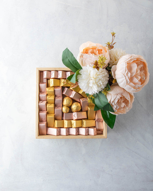 Pastel Diwali Collection by NJDChocolate & ConfectioneryYOUR GIFT CONTAINS Contains: Assorted Belgian chocolates 60pcs Flavors: Assorted chocolates with Praline, Ganache, Roasted Nuts, Biscoff and Puree flavors. Tray Dimensions: Wide: 20cmX20cm Height: 5c