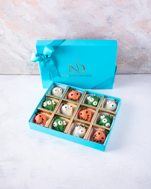 Spooktacular StrawberryChocolate & Confectionery12pcs dressed-up strawberries, dipped in colored chocolate and decorated with additional melted chocolate. Packed as shown in the picture Tray dimensions: length: 19cm wide: 24cm HANDLING AND STORAGE Keep aw